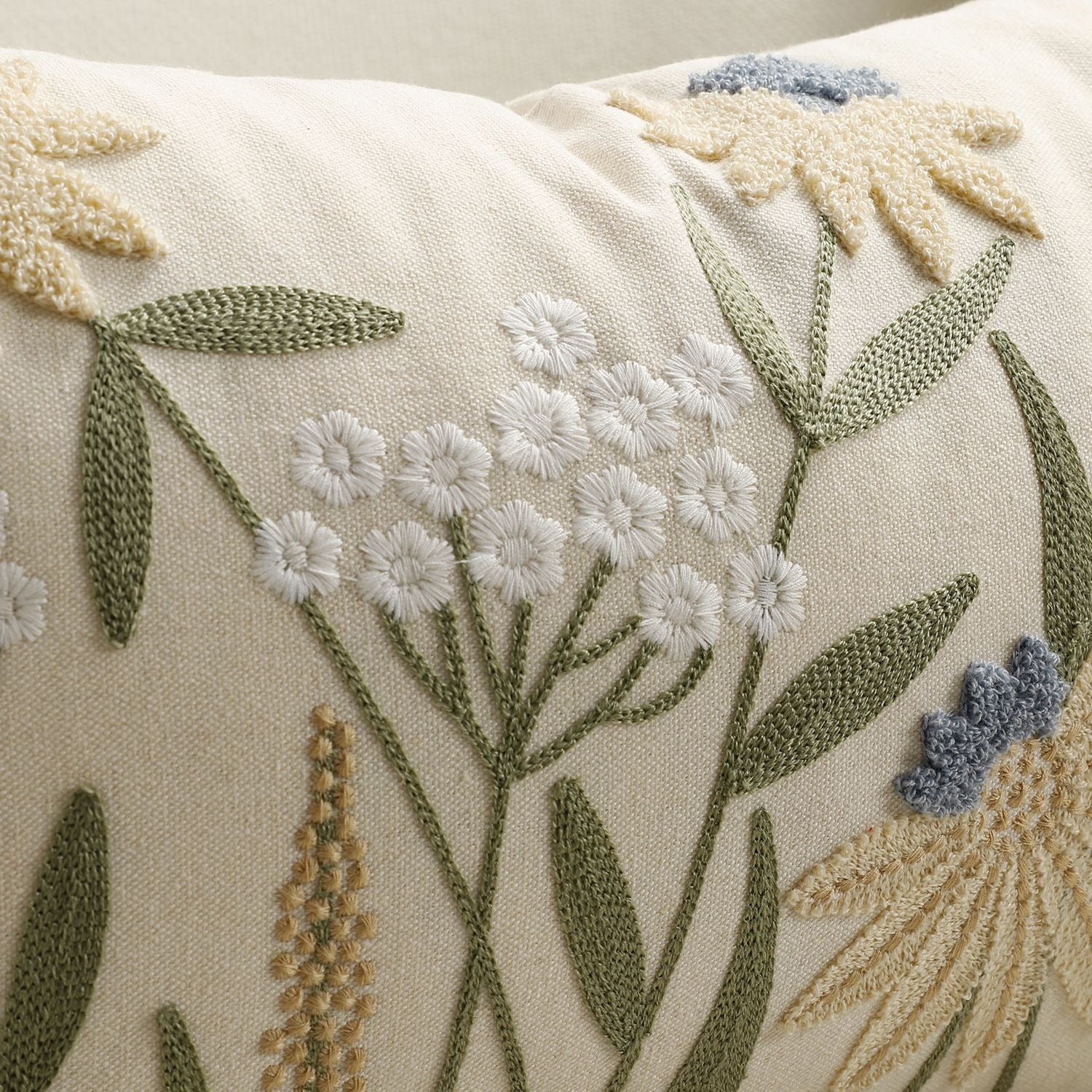 Close-up of 100% cotton canvas fabric on embroidered cushion cover