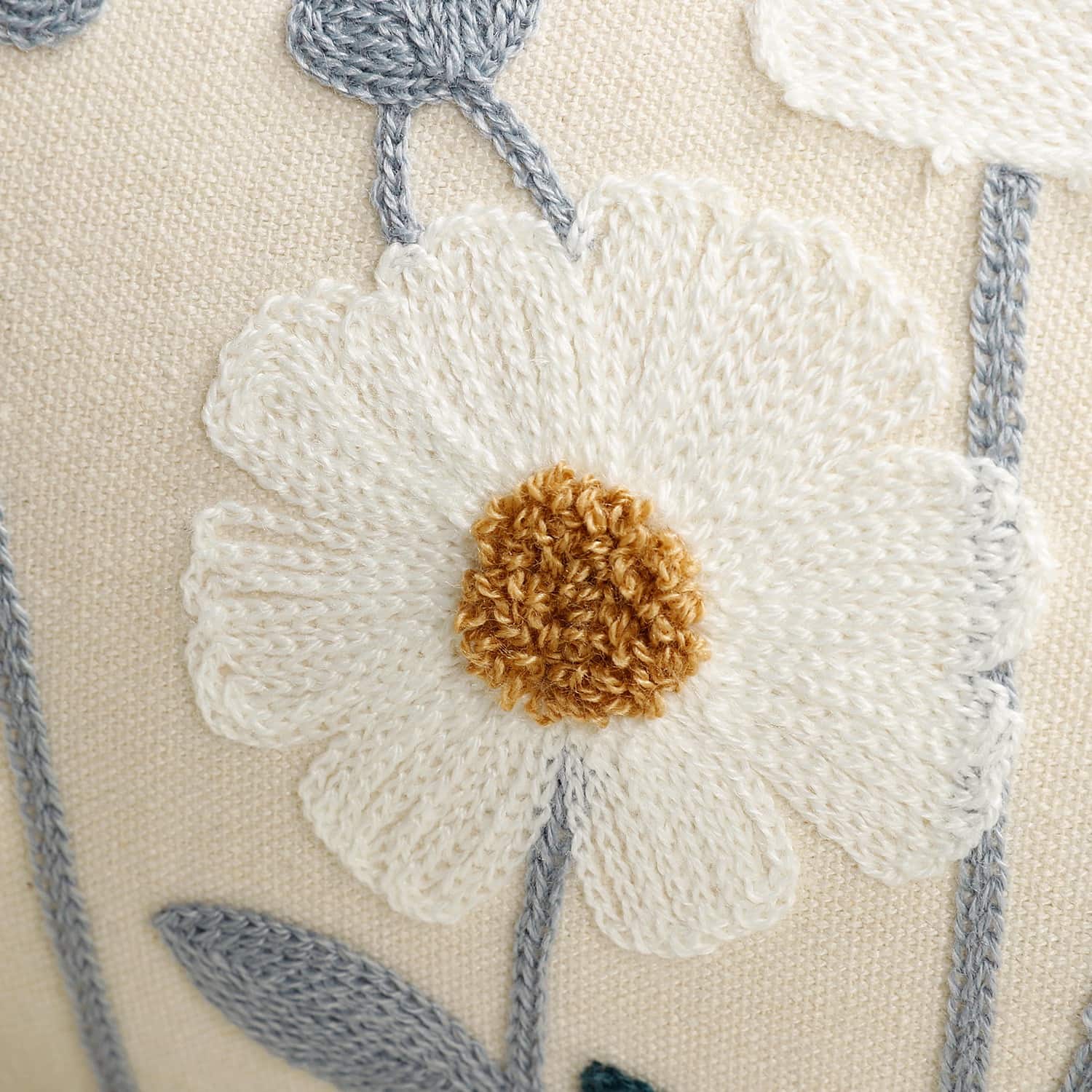 Close-up of 100% cotton canvas fabric on embroidered cushion cover