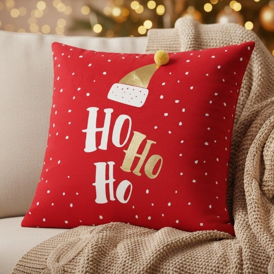 Red Christmas cushion with 'Ho Ho Ho' text and Santa hat design on a black background